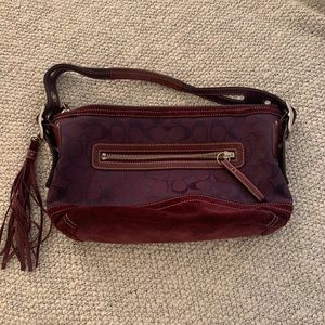Gorgeous wine color coach purse with tassel